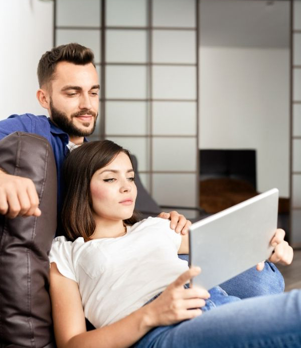 Young couple looking at a tablet together